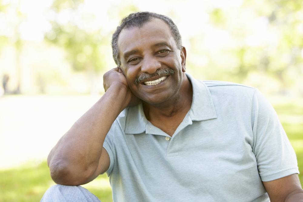Man smiling with dental implants at the dentist melbourne fl