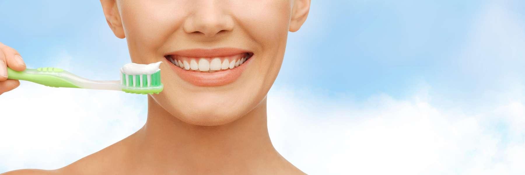 smiling woman with toothbrush | Melbourne, FL